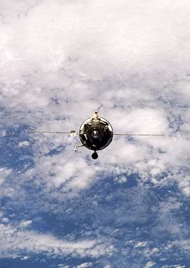 Spacecraft above Earth's clouds