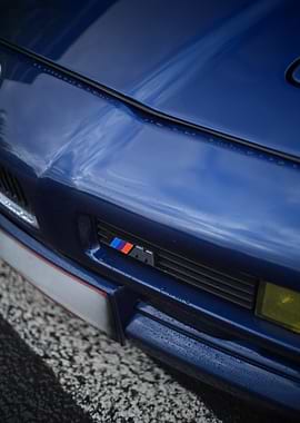 BMW M Emblem on Blue Car