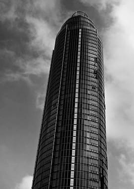 Modern Skyscraper Against Cloudy Sky