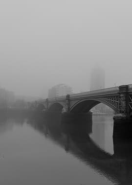 Misty Bridge Over River
