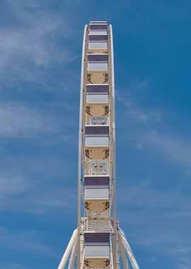 Ferris Wheel Against Blue Sky