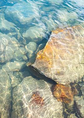 Sunlight on Clear Water and Rocks