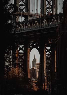 Empire State Building framed by the Manhattan Bridge