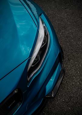 Close-up of a Teal Sports Car Headlight BMW M2