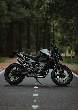 Black KTM Motorcycle on Forest Road
