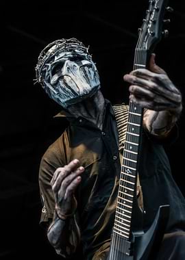 Masked Guitarist Playing Electric Guitar