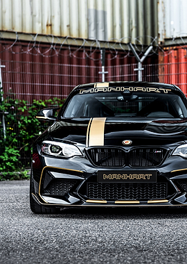 Black Manhart BMW M2 with Gold Stripes