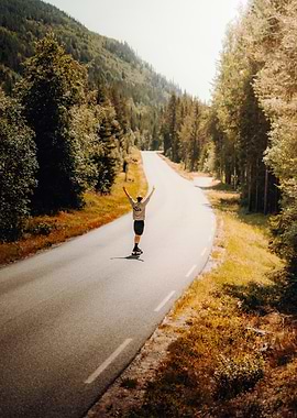 Skateboarder on a Mountain Road