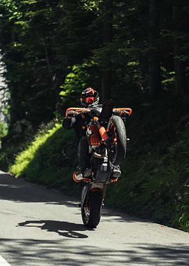 Motorcyclist performing a wheelie