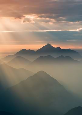 Dawn Over the Peaks – Golden Light Through Misty Mountain
