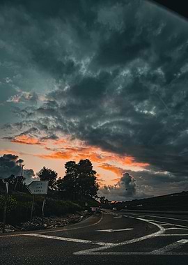 Dramatic Sunset Over a Winding Road