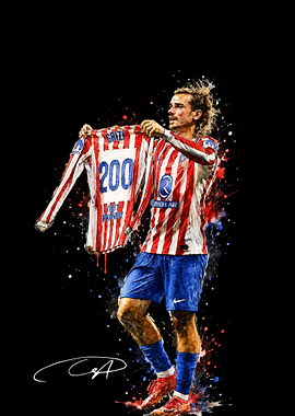 Antoine Griezmann holding Atletico Madrid jersey