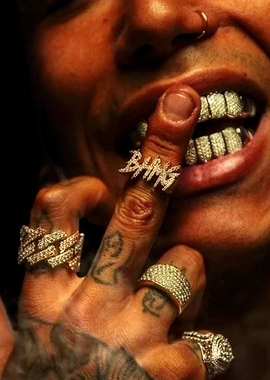 Man with diamond grills and rings