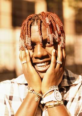 Rapper Lil Yachty with Red Braids and Jewelry