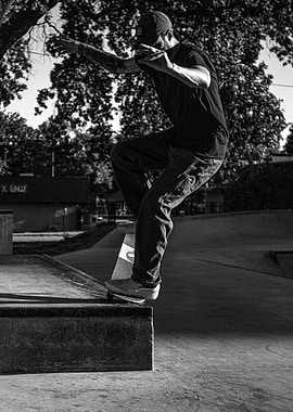 Skateboarder performing a trick at a skatepark