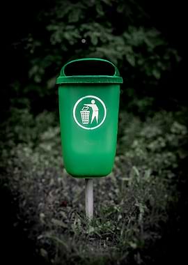 Green Trash Can with Recycling Symbol