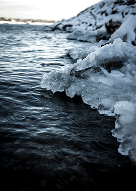 Frozen Shoreline with Rippling Water