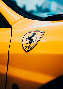 Yellow Ferrari with Prancing Horse Emblem