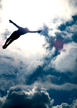 Silhouette of a diver against the sky