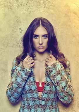 Woman in patterned jacket and red top