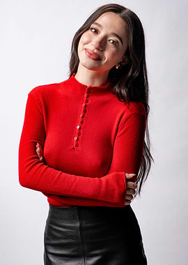 Young Woman in Red Top and Black Skirt
