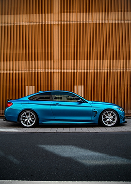 Blue BMW Coupe on a City Street