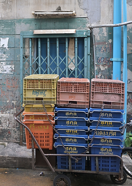 Stack of blue crates on a cart