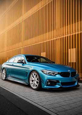 Blue BMW Coupe on Pavement