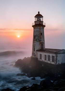 Foggy Lighthouse at Sunrise