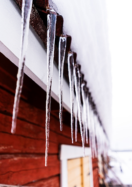 Icicles hanging from a red building
