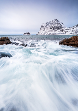 Winter Coastal Landscape with Snow-Capped Mountains