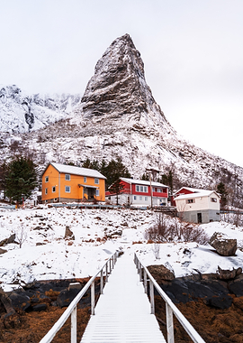 Snowy Norwegian Village with Mountain Peak