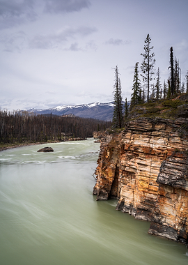 River flowing past rocky cliffs