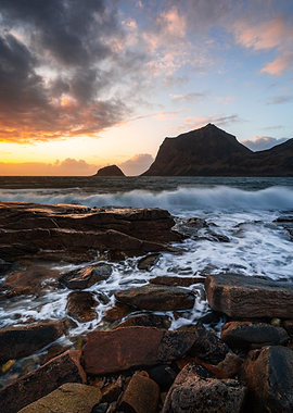 Dramatic Sunset Over Rocky Coastline