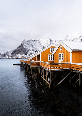 Orange Rorbuer in Snowy Lofoten