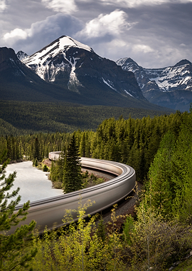 Train curving through a mountain landscape