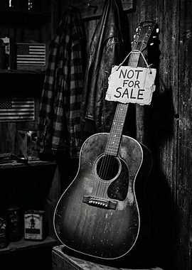Acoustic Guitar with 'Not For Sale' Sign