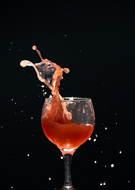 Red Liquid Splash in Wine Glass