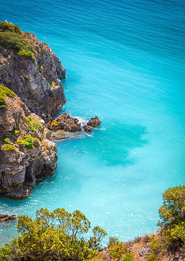Turquoise water meets rocky coast