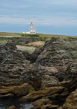 Lighthouse Pointe des Poulains on a Rocky Coast