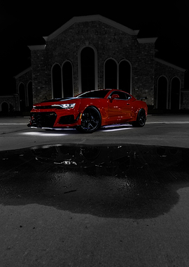 Red Chevrolet Camaro at Night
