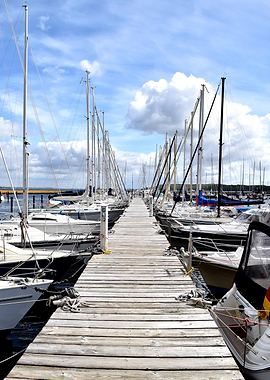 Wooden Pier with Sailboats at Marina