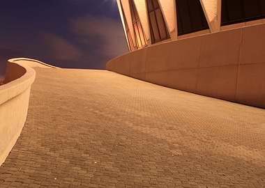 A night shot on a ramp leading to a coliseum.