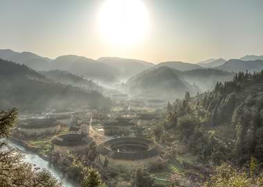 Sunrise over He Keng Tulou village in Fujian province, ...