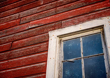 Abstract of a window on a wall from red boards