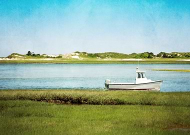 A fishing boat glides through the water as seen from th ...