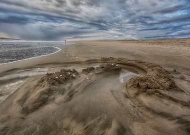 Woman of the Sea. Wide angle view of tide pool in fore ...