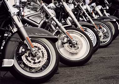a row of motorcycle's front tyres