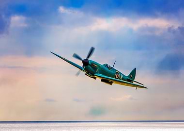 Reconnaissance Spitfire flying low over the sea near En ...