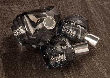 The nicely stacked glass aftershave bottles on a wooden ...